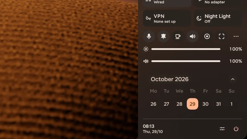 The control panel: Internet, Bluetooth, VPN and Night Light in front, a row of switches, brightness and volume, and the week.