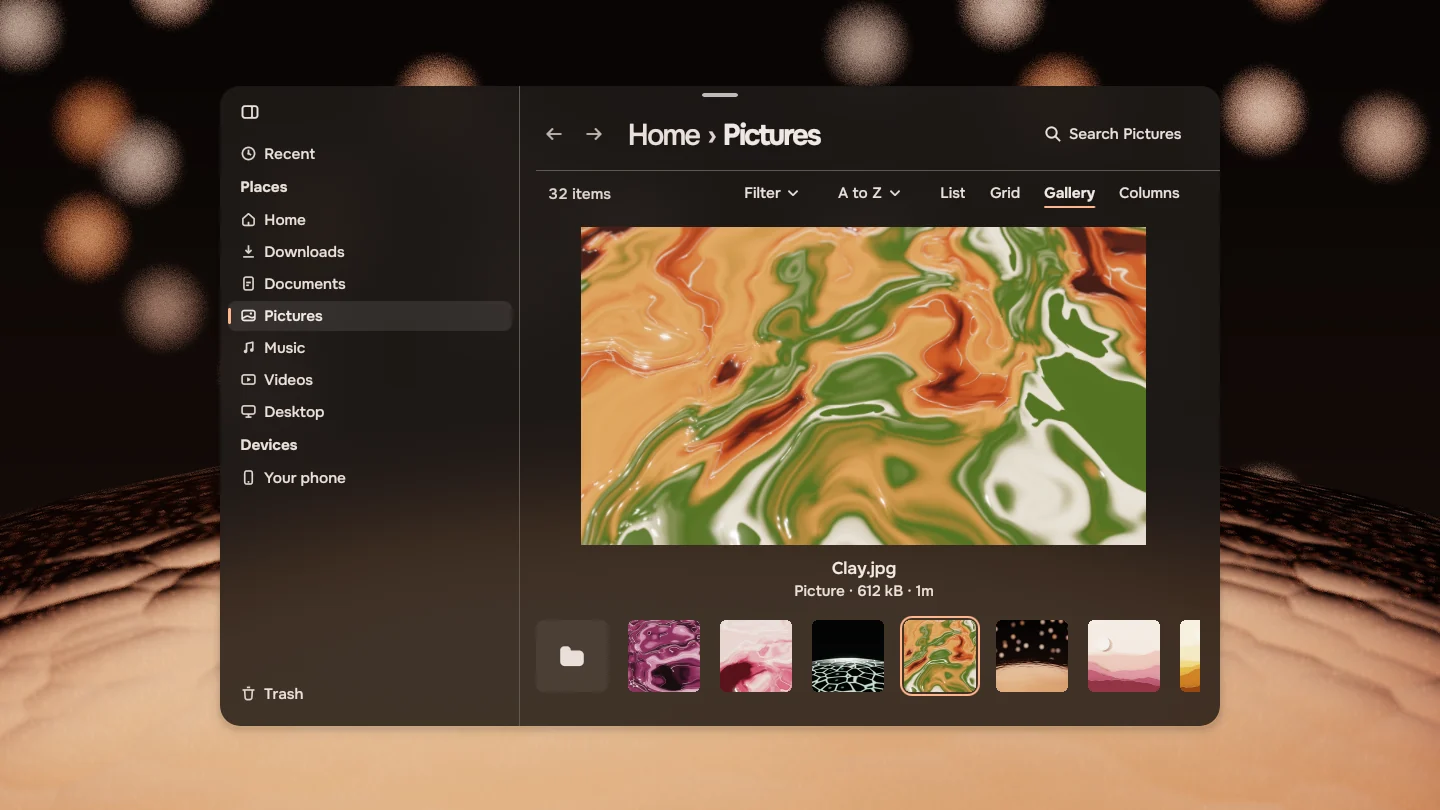 Files showing the Pictures folder in Gallery view, one picture large above a strip of the others.